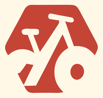 Negative Space Bicycle Hexagon Badge #fff8e7/#c44536